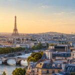 Paris skyline with the Eiffel Tower and Seine at sunrise